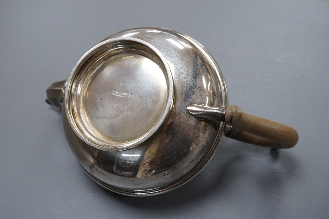 A George V silver circular teapot, by Goldsmiths & Silversmiths Co Ltd, London, 1918, gross 17.5oz.